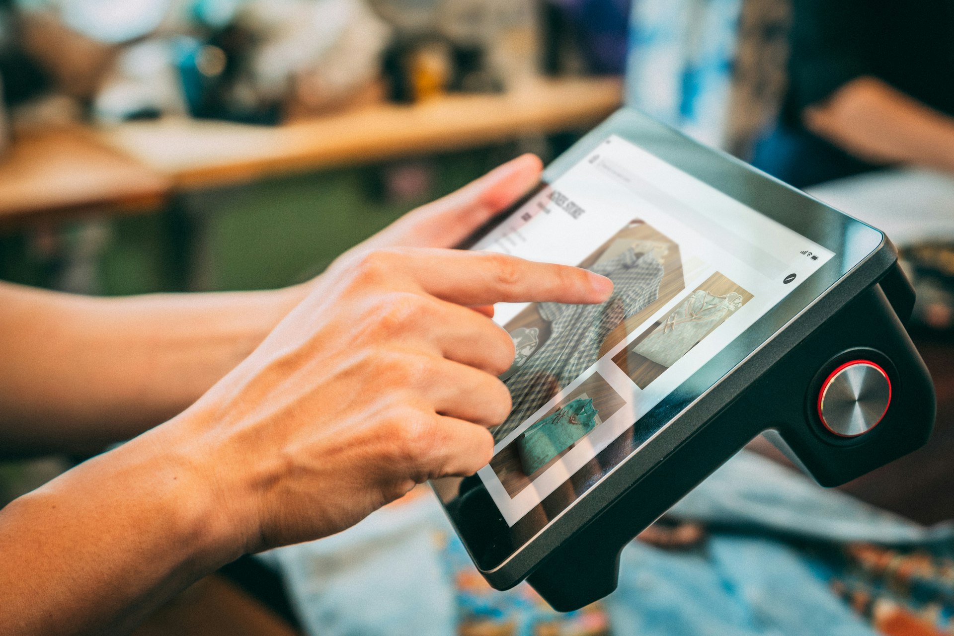 Restaurant manager using a tablet during service